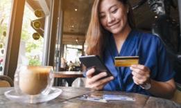 Woman entering credit card information on phone